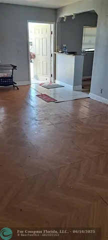 a view of a livingroom with wooden floor