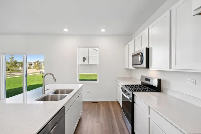 a kitchen that has a sink and a stove
