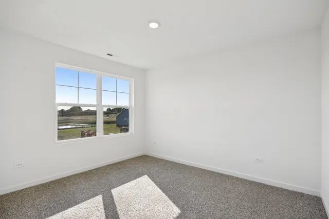 a bed room with a bed and a window