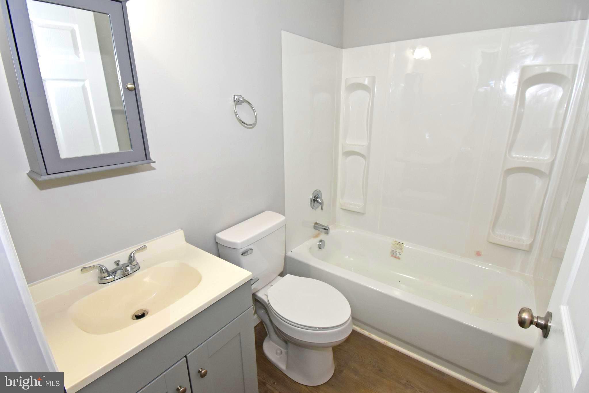 4078 Jacksonville Road Crisfield, MD 21817 - Photo 18 of 43 a bathroom with a sink toilet and shower