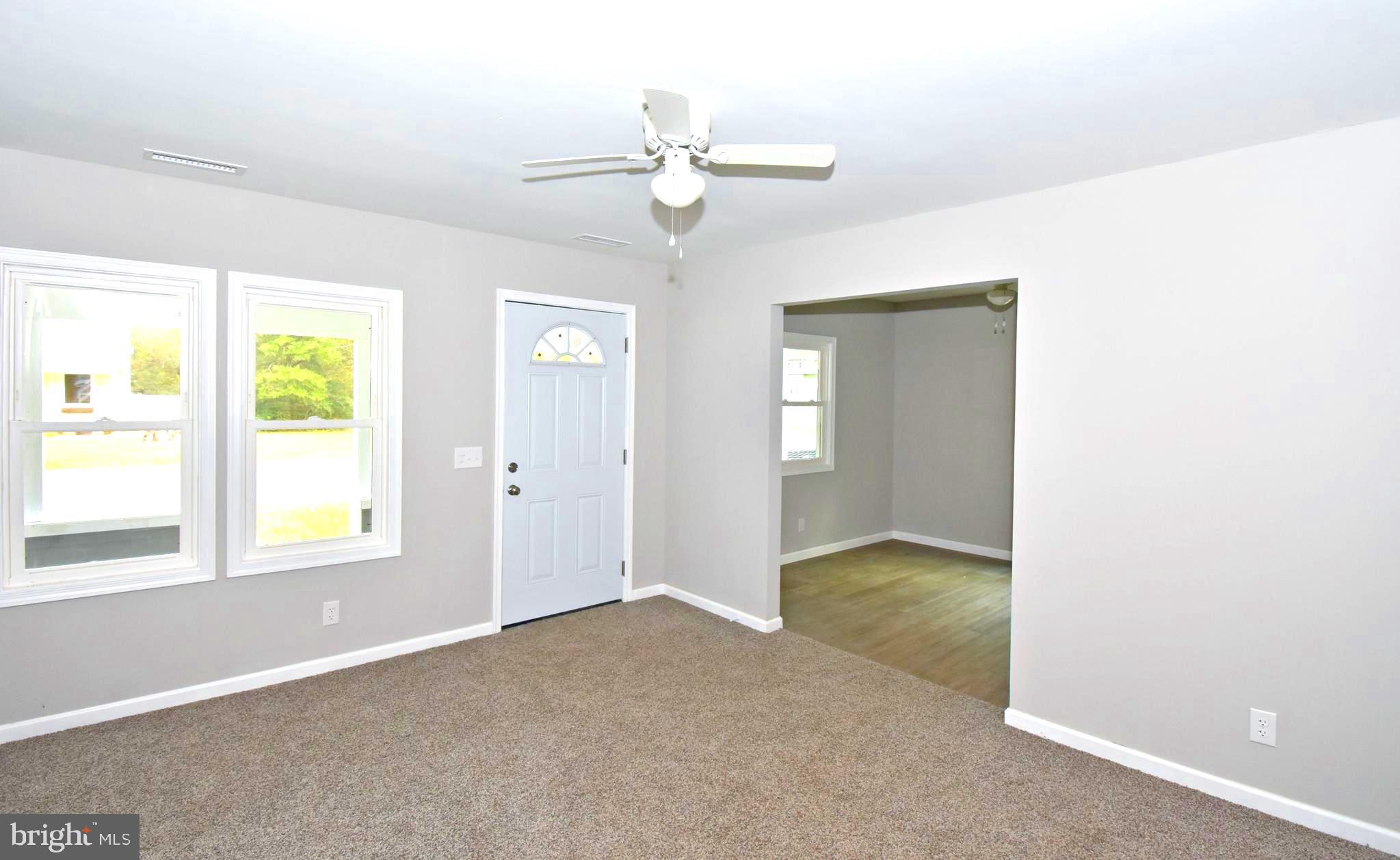 4078 Jacksonville Road Crisfield, MD 21817 - Photo 2 of 43 a view of an empty room with a window