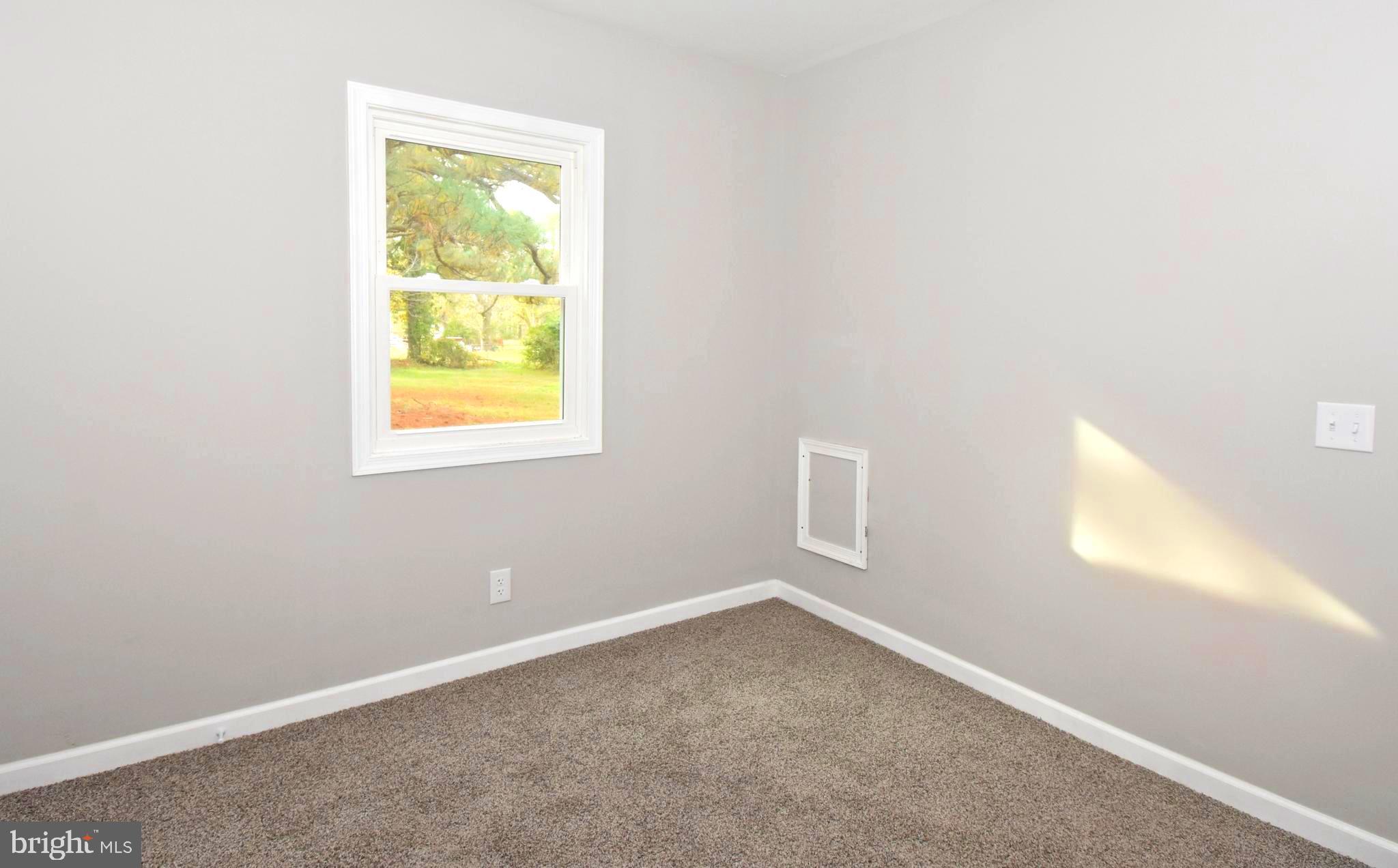 4078 Jacksonville Road Crisfield, MD 21817 - Photo 28 of 43 an empty room with a window