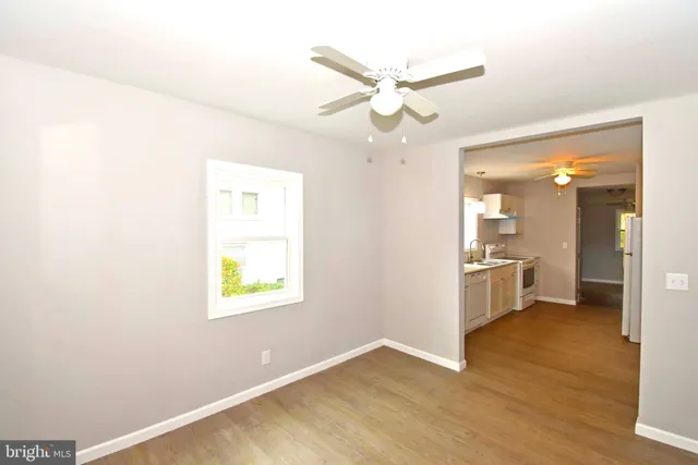 a view of a hallway with a window