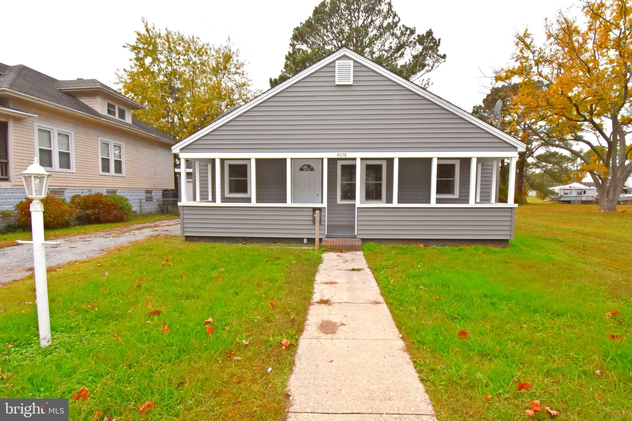 4078 Jacksonville Road Crisfield, MD 21817 - Photo 37 of 43 a front view of a house with a yard