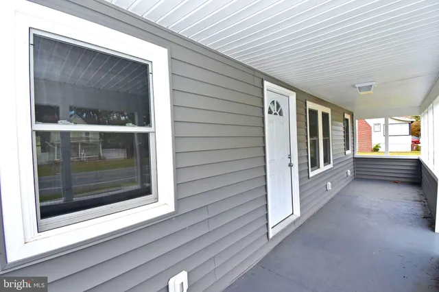 a view of porch with a bench