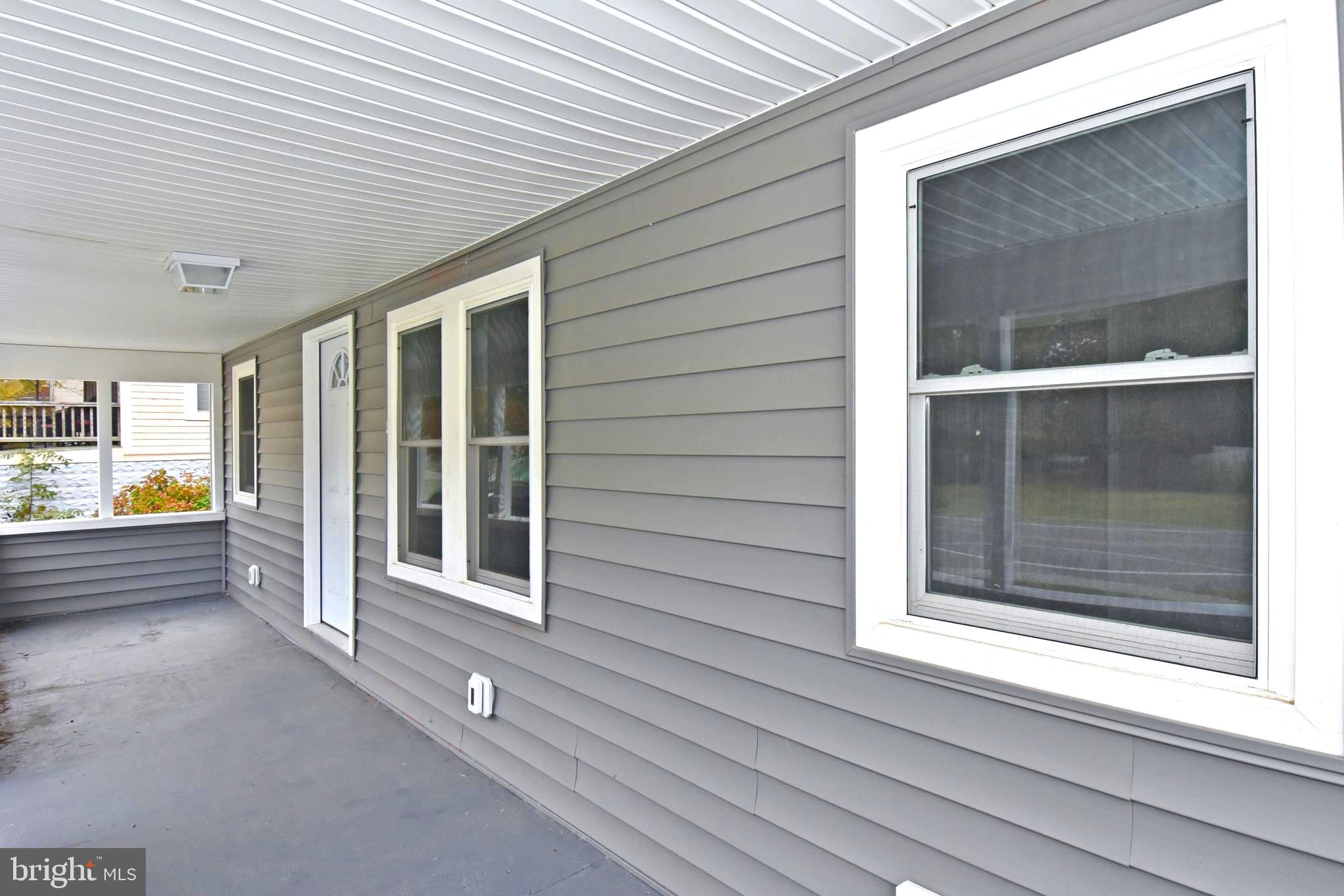 4078 Jacksonville Road Crisfield, MD 21817 - Photo 40 of 43 a view of porch with a bench