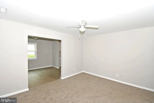 an empty room with a bathroom