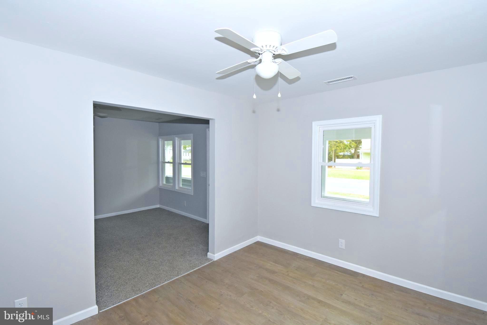 4078 Jacksonville Road Crisfield, MD 21817 - Photo 7 of 43 a view of an empty room with a window