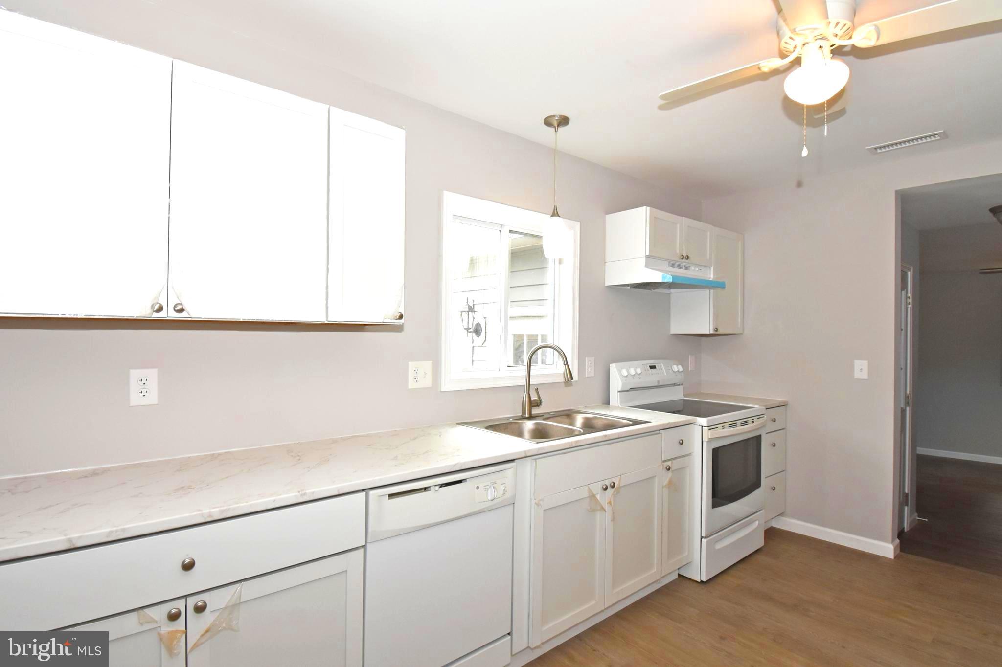 4078 Jacksonville Road Crisfield, MD 21817 - Photo 9 of 43 a kitchen with a sink cabinets and window