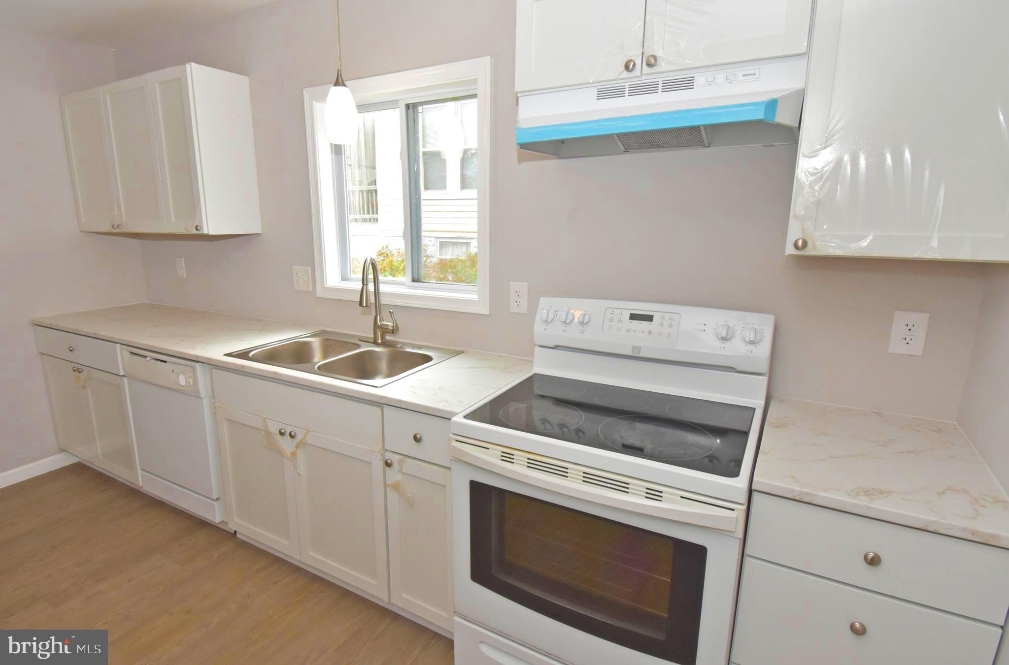 4078 Jacksonville Road Crisfield, MD 21817 - Photo 10 of 43 a kitchen with cabinets appliances and a sink