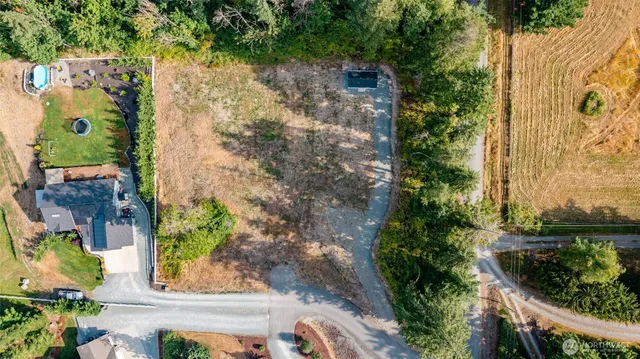 an aerial view of residential house with outdoor space
