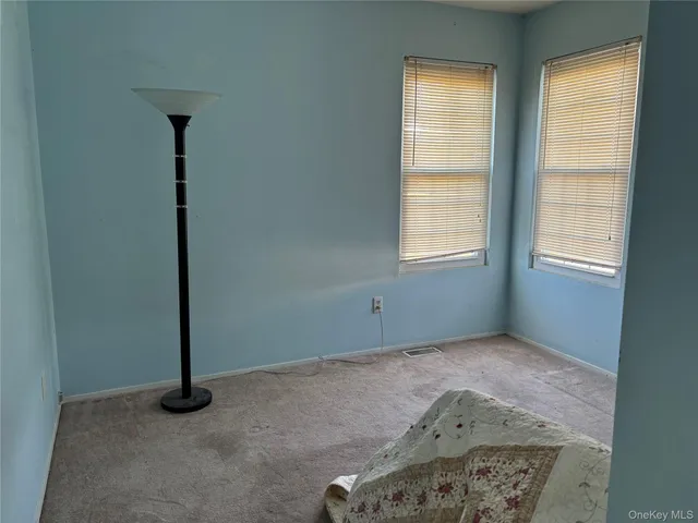 a view of an empty room with windows