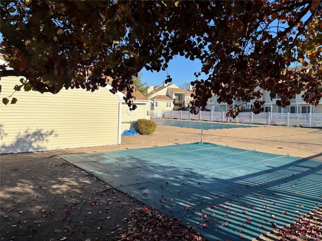 a view of a house with backyard and porch