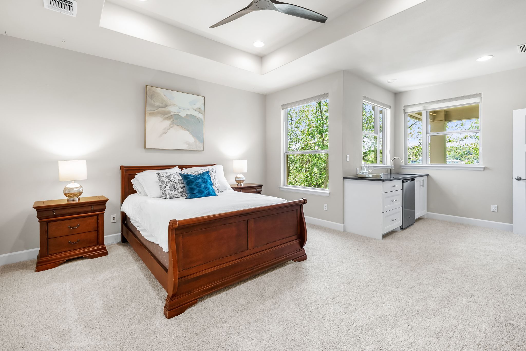 14213 Red Feather Trail Austin, TX 78734 - Photo 18 of 39 a spacious bedroom with a bed and a chandelier