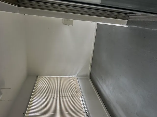a view of a closet with wooden floor