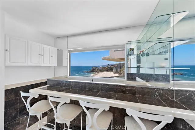 a kitchen with a table and chairs in it