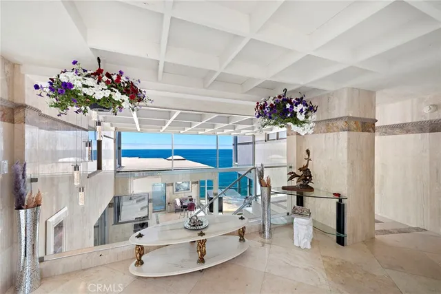 a view of living room with furniture and flowers