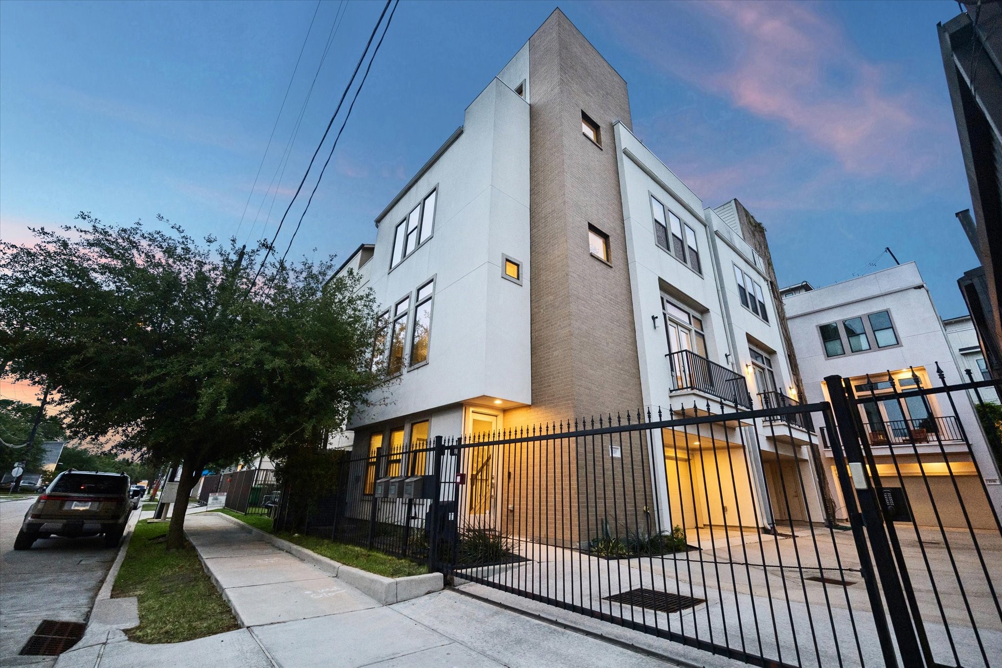 Striking contemporary architecture with clean lines, gated entry, and a bold corner presence in one of Houston’s most vibrant neighborhoods.