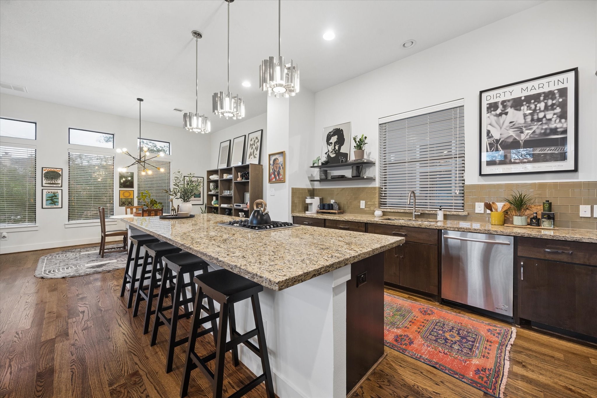 2110 Genesee Street Houston, TX 77006 - Photo 16 of 47 Open dining area flows naturally into the kitchen, ideal for everyday living and entertaining.
12. Dining Alternate
Well-proportioned dining space with elevated ceilings and strong natural light.
13. Kitchen Wide
Spacious kitchen featuring a large center island, extensive cabinetry, and granite countertops.
14. Kitchen Front View
Well-appointed kitchen with stainless steel appliances, built-in oven, and ample storage.
15. Kitchen Reverse
Functional layout with generous prep space, gas cooktop, a
