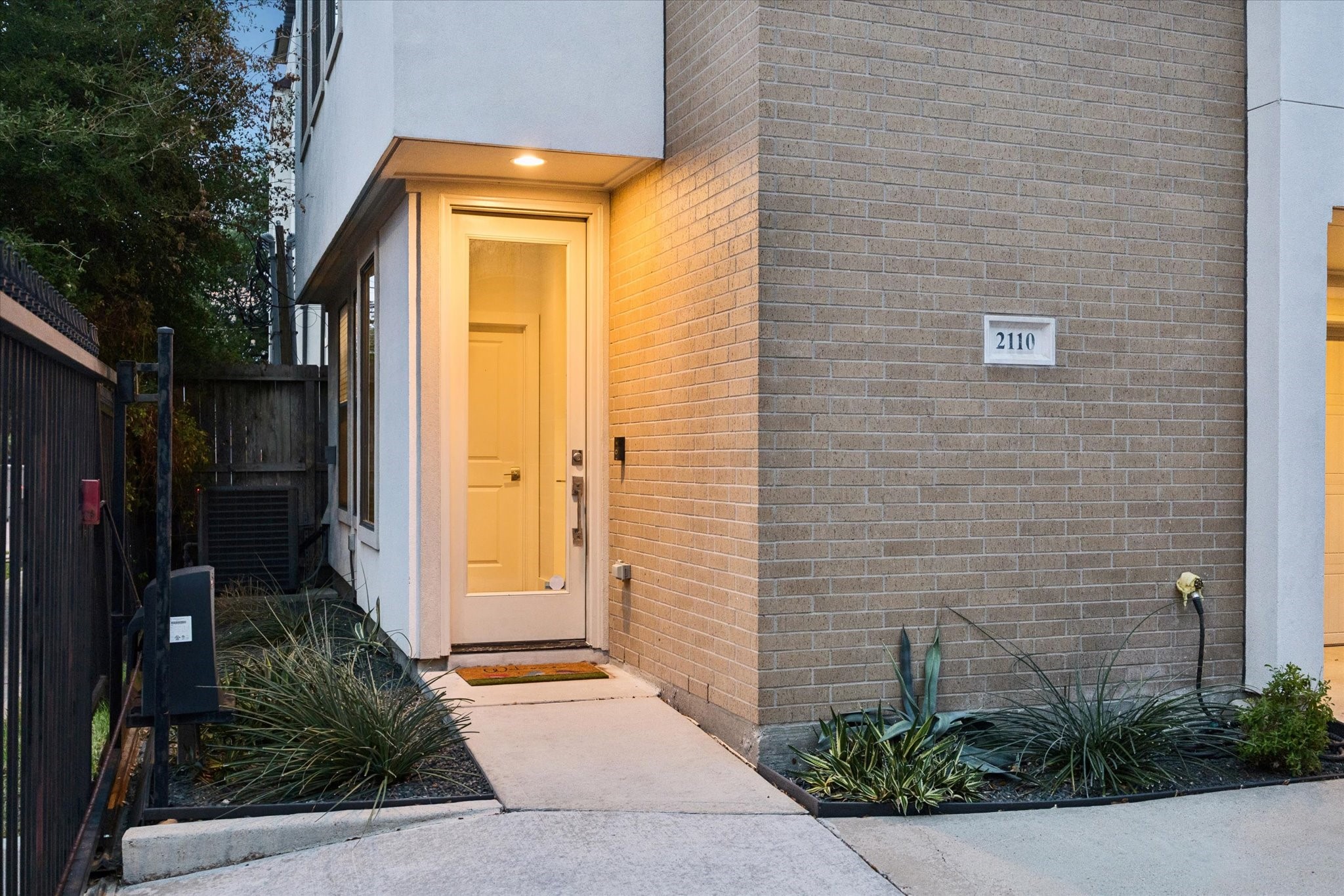 2110 Genesee Street Houston, TX 77006 - Photo 2 of 47 Gated walkway leads to a private ground-level entrance, offering both security and a quiet sense of arrival.