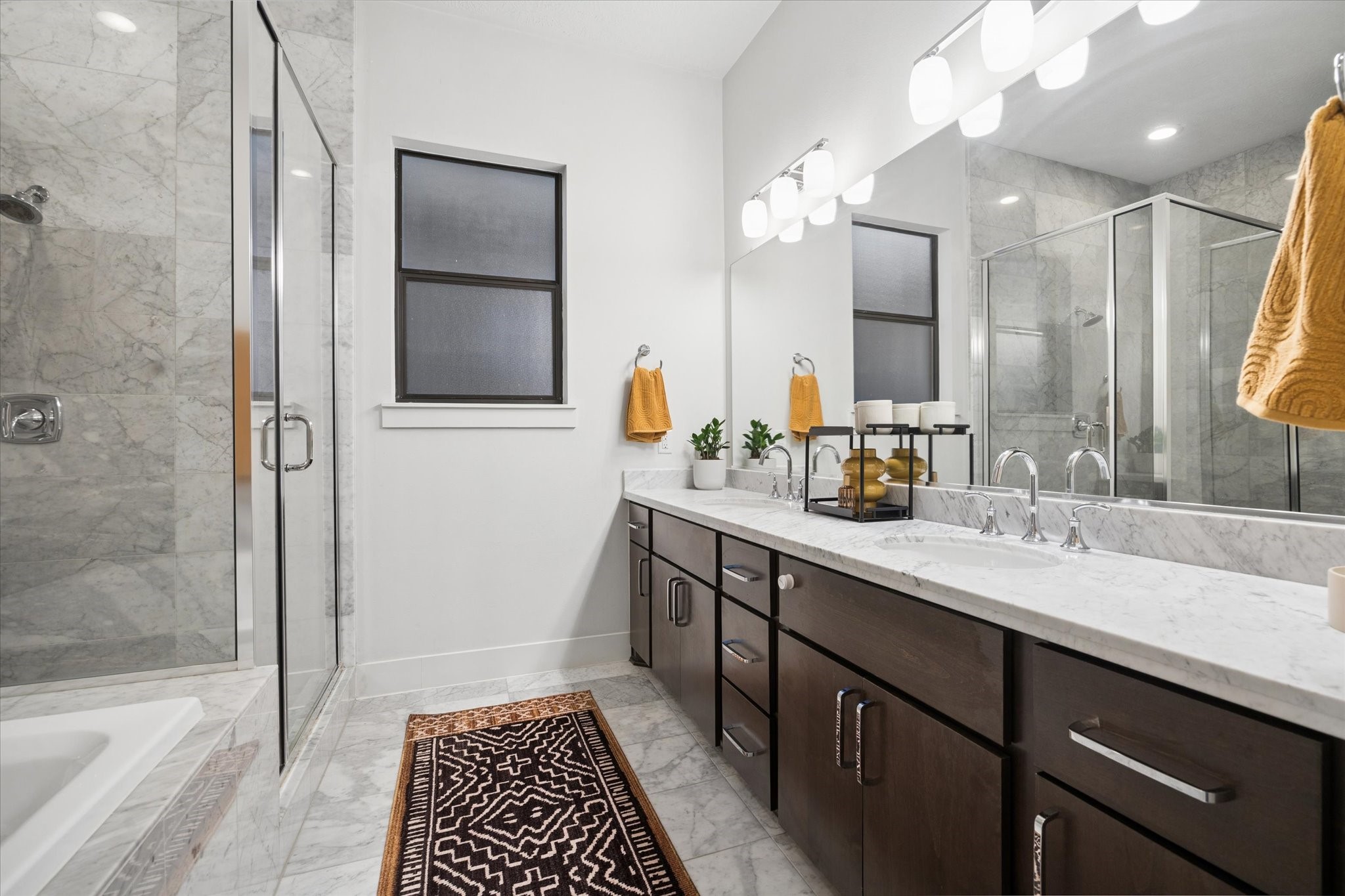 2110 Genesee Street Houston, TX 77006 - Photo 23 of 47 Dual-sink vanity with extensive counter space, custom cabinetry, and a clean, modern finish.