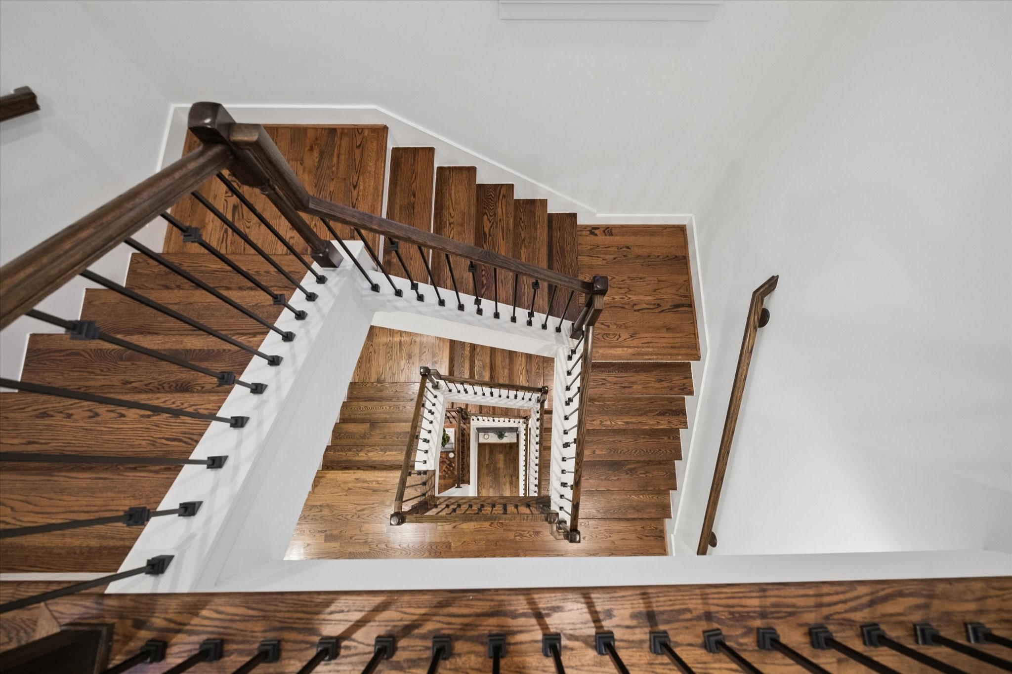 2110 Genesee Street Houston, TX 77006 - Photo 27 of 47 Dramatic multi-story staircase with designer railing detail