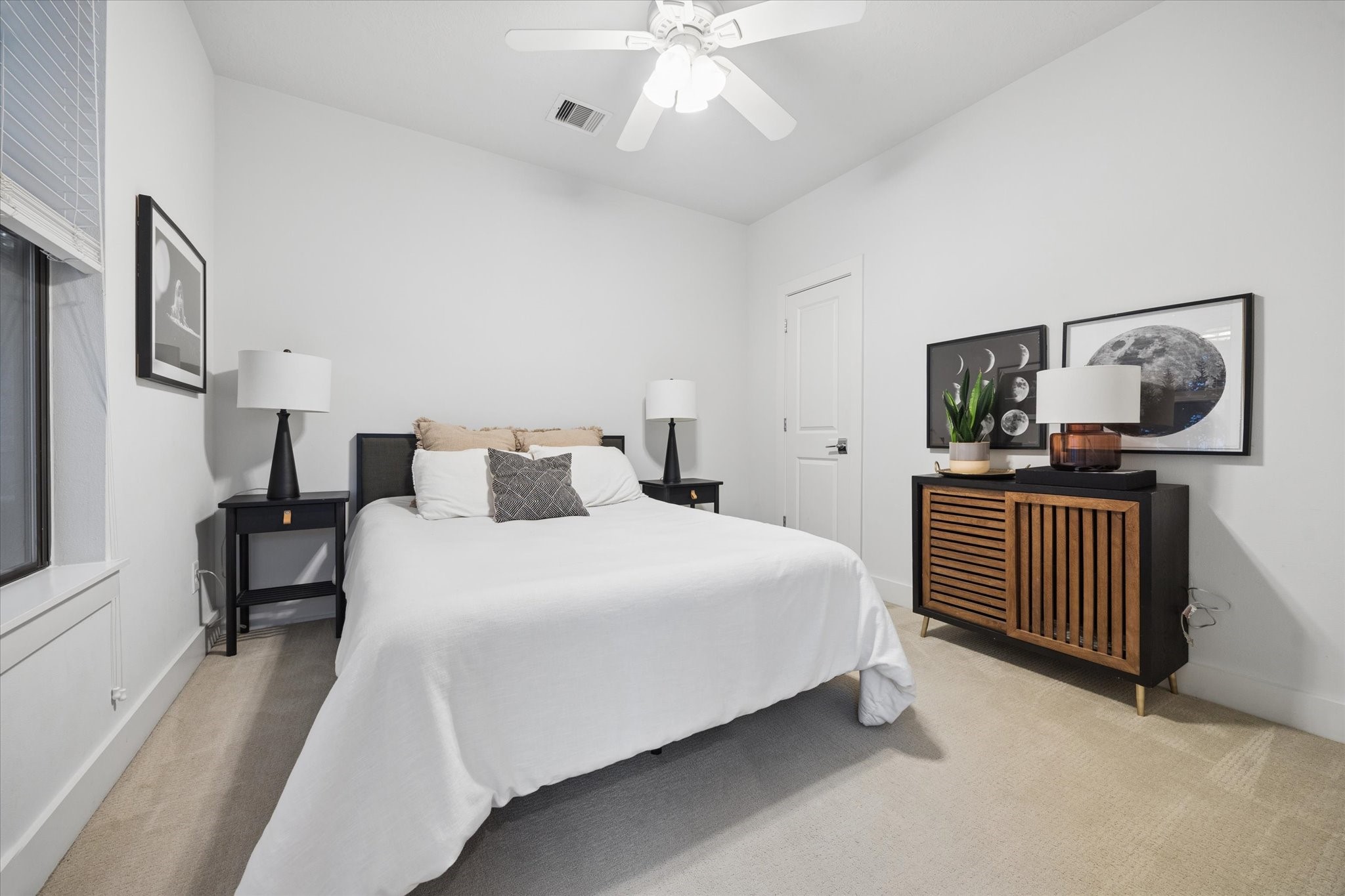 2110 Genesee Street Houston, TX 77006 - Photo 32 of 47 First level secondary bedroom offers a serene retreat with soft natural light and a versatile layout—perfect for guests, a home office, or a private escape.