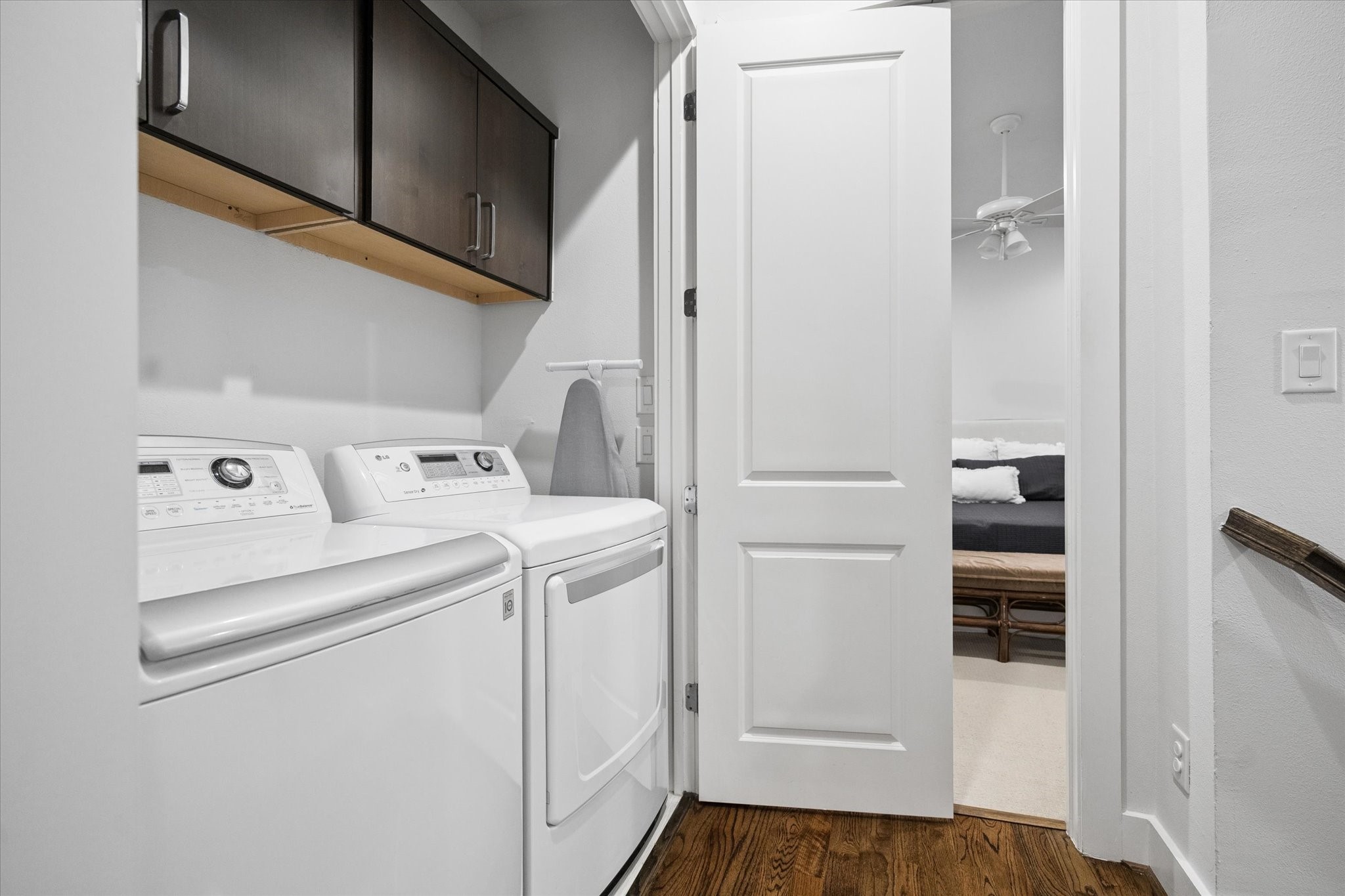 2110 Genesee Street Houston, TX 77006 - Photo 36 of 47 In-unit laundry with upper storage cabinetry