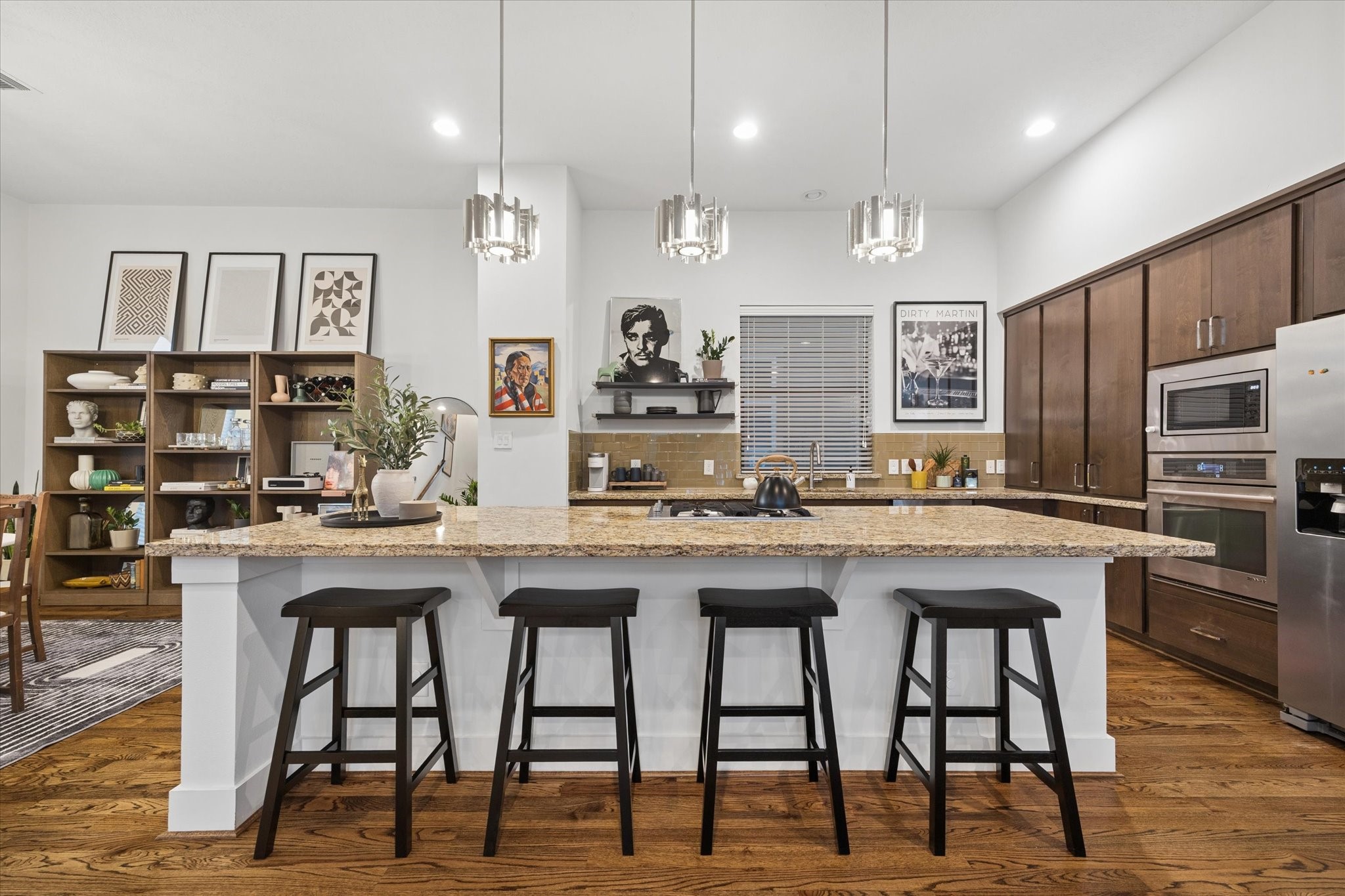 2110 Genesee Street Houston, TX 77006 - Photo 4 of 47 The main living level is anchored by an expansive chef’s kitchen, where a generous granite island invites everything from morning coffee to evening gatherings.