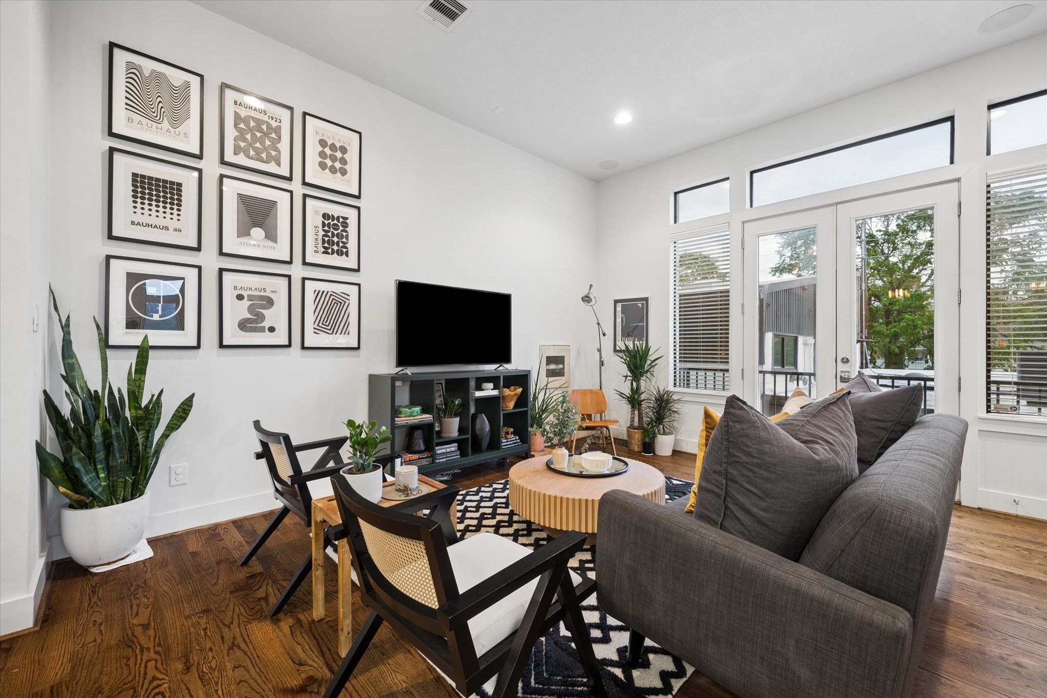 2110 Genesee Street Houston, TX 77006 - Photo 5 of 47 Expansive living area with high ceilings, oversized windows, and abundant natural light.