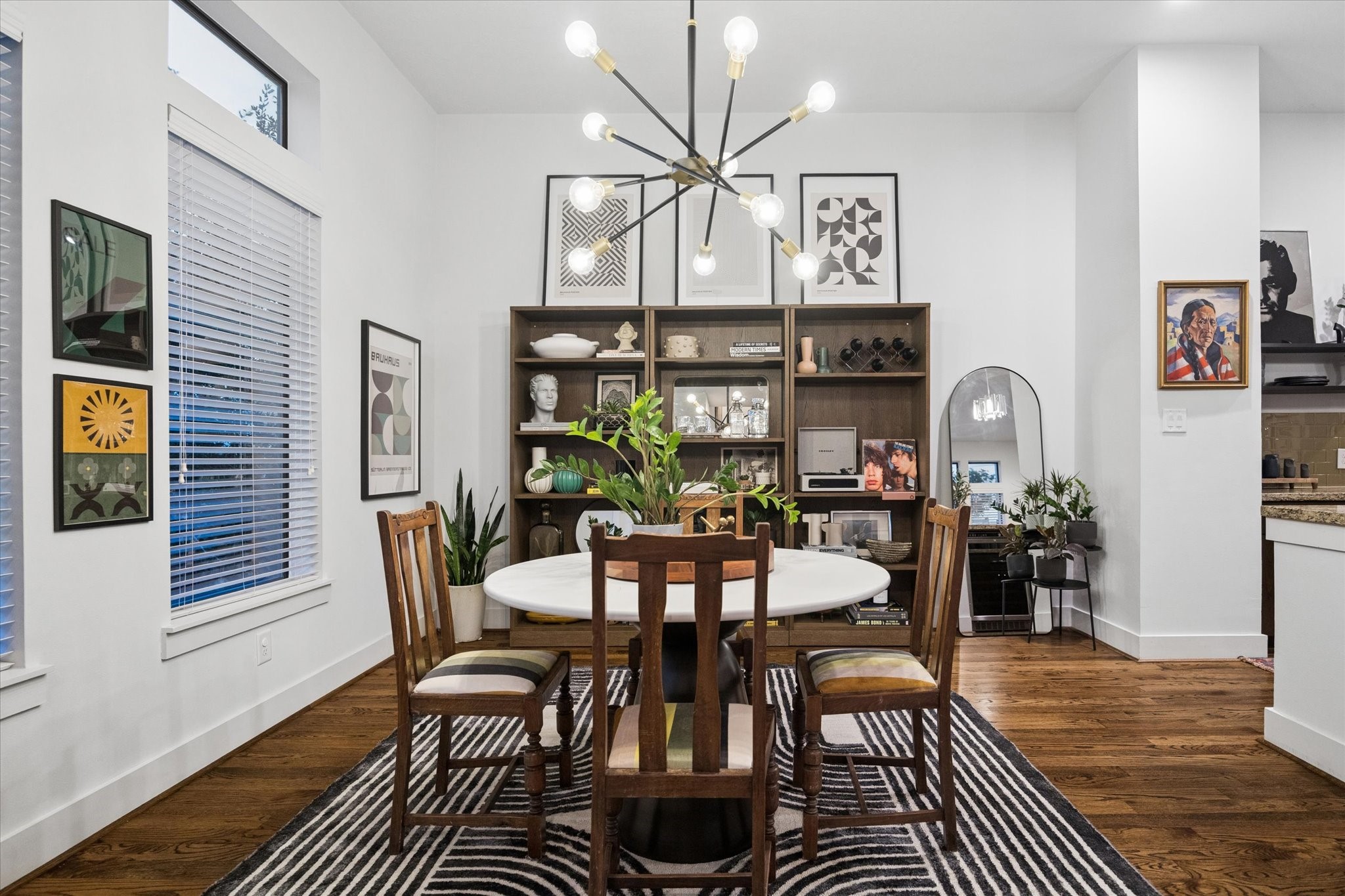 2110 Genesee Street Houston, TX 77006 - Photo 7 of 47 Dedicated dining space framed by tall windows, creating a bright and inviting setting.