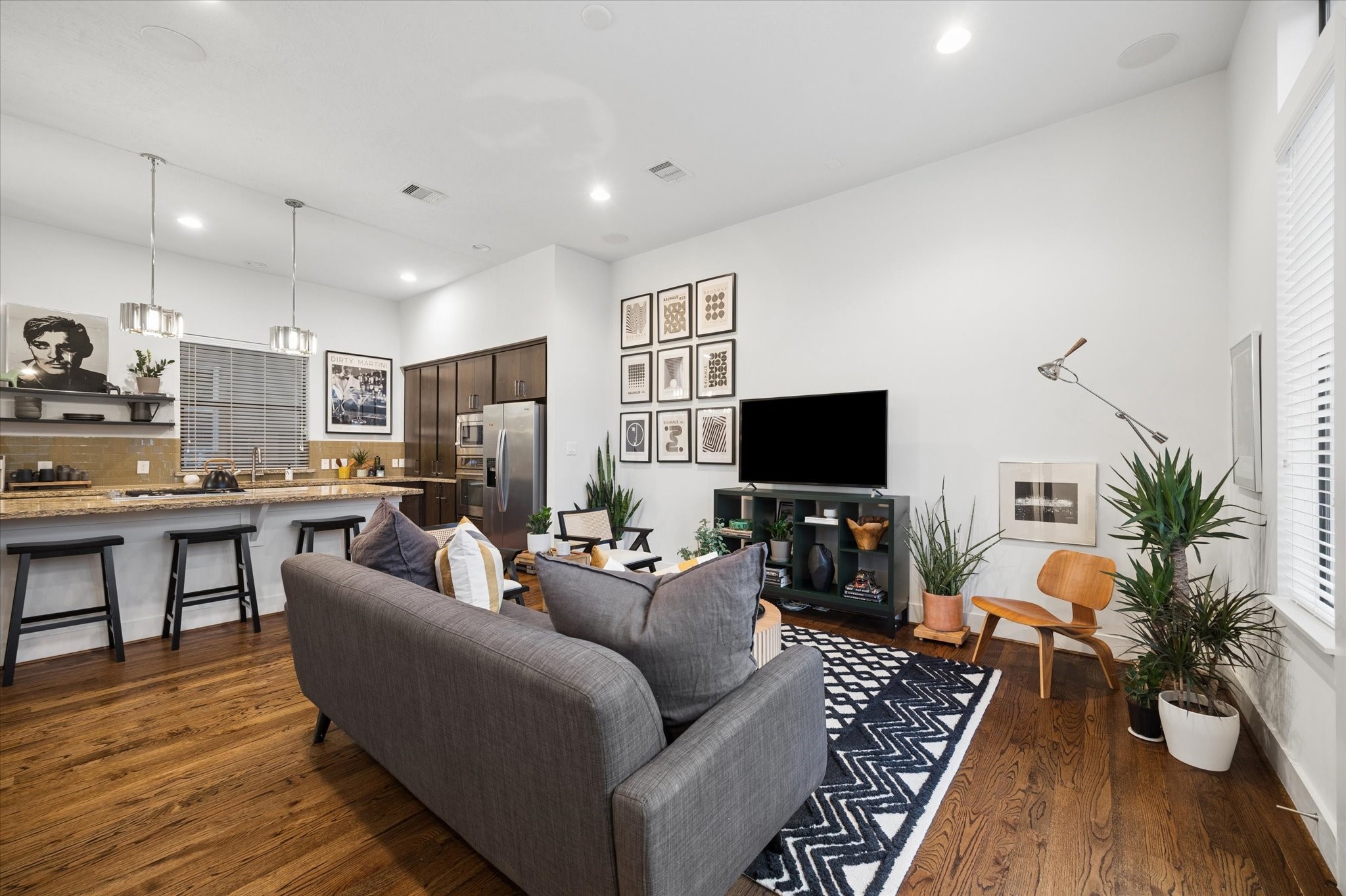 2110 Genesee Street Houston, TX 77006 - Photo 9 of 47 Seamless flow between living spaces with architectural sightlines and elevated ceiling heights.