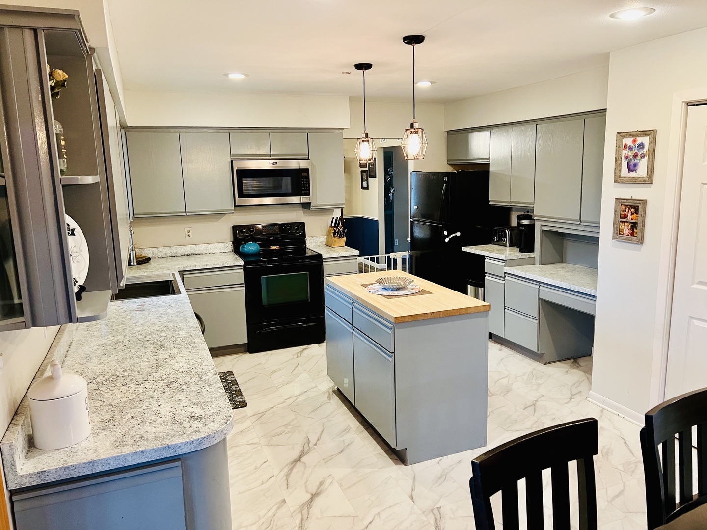 212 Drake Avenue Rochelle, IL 61068 - Photo 12 of 32 a kitchen with a sink stove and refrigerator