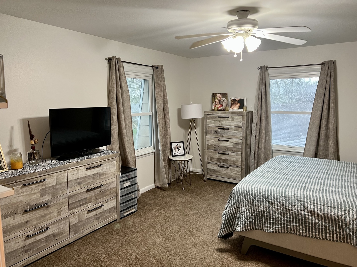 212 Drake Avenue Rochelle, IL 61068 - Photo 22 of 32 a bedroom with a bed and a flat tv screen on wall