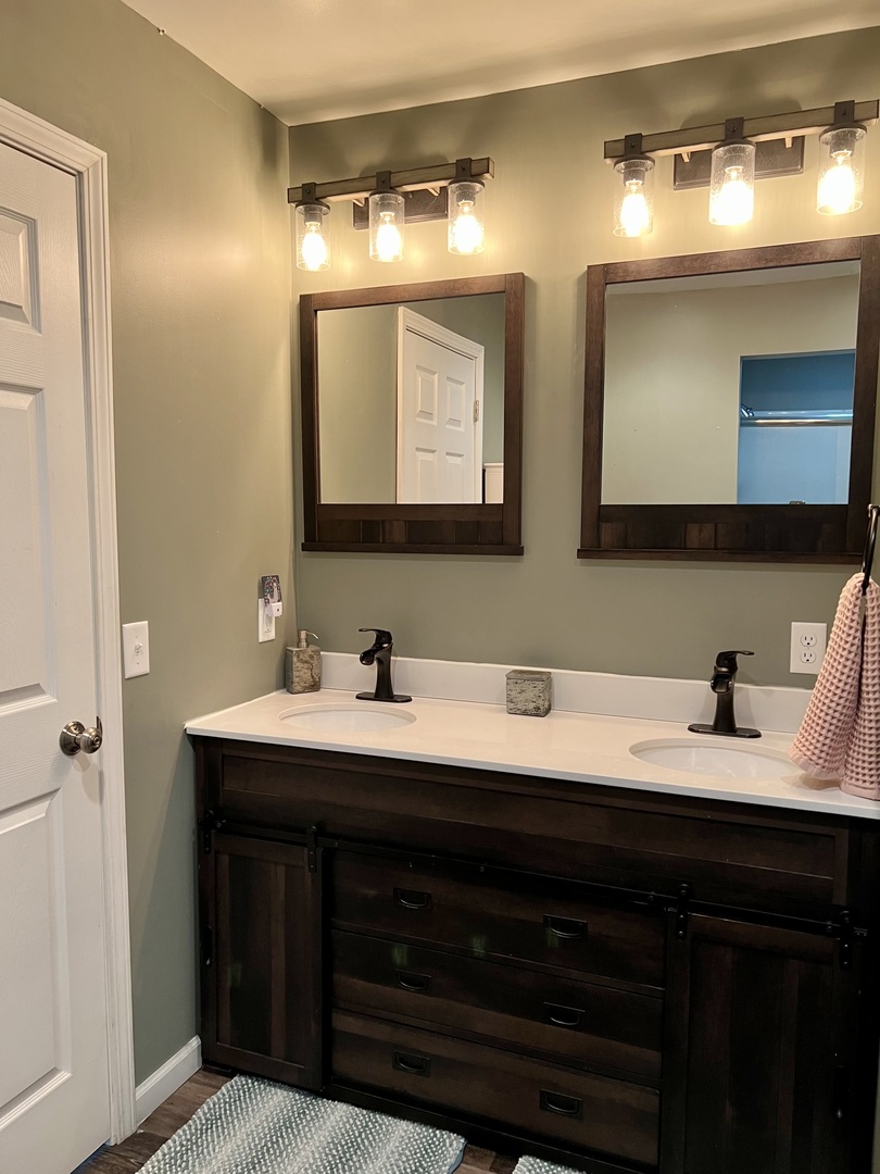 212 Drake Avenue Rochelle, IL 61068 - Photo 23 of 32 a bathroom with double sink and a mirror