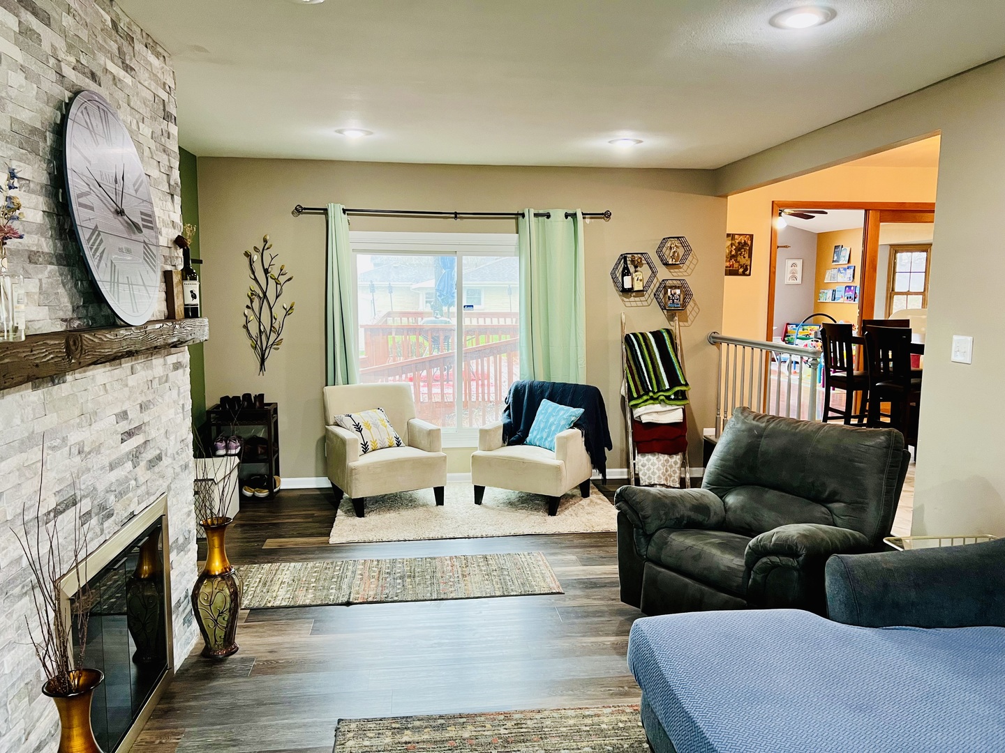 212 Drake Avenue Rochelle, IL 61068 - Photo 4 of 32 a living room with furniture a fireplace and a large window