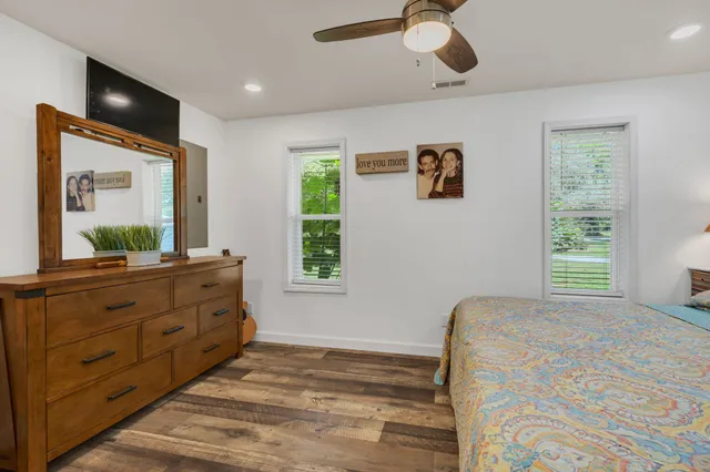 a bedroom with a bed and a dresser