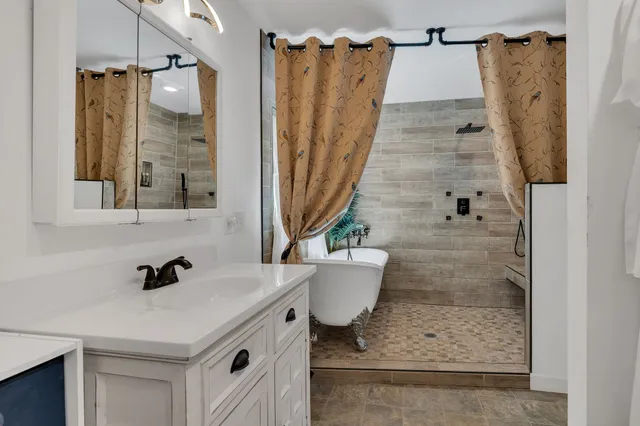 a bathroom with a sink and a shower