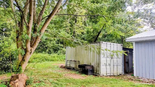 a backyard of a house with lots of green space