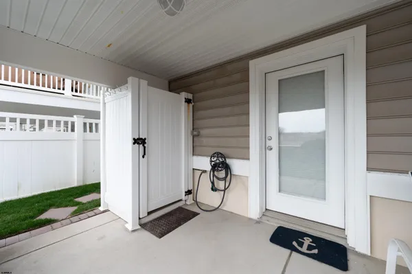 a view of an entryway with wooden floor and door