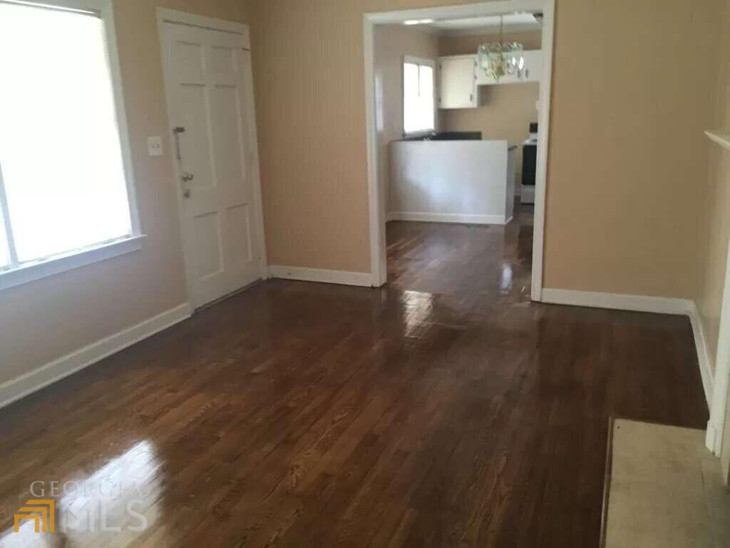 1756 Parkhill Drive Decatur, GA 30032 - Photo 1 of 1 a view of a hallway with wooden floor and a living room