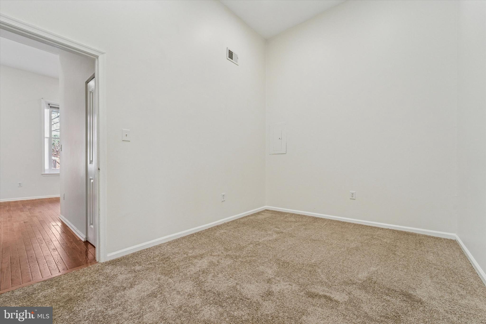 1606 Wallace Street, Unit 101 Philadelphia, PA 19130 - Photo 9 of 10 wooden floor in a empty room