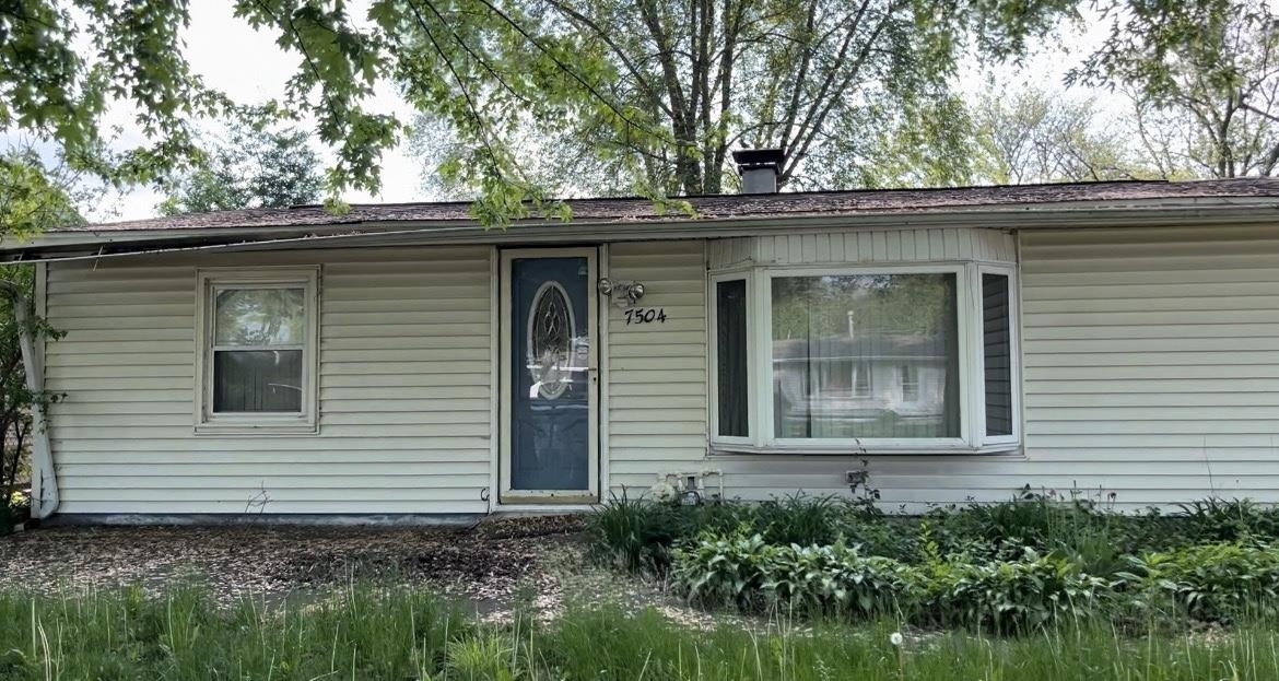 7504 Mildred Road Machesney Park, IL 61115 - Photo 1 of 1 a view of a house with a window