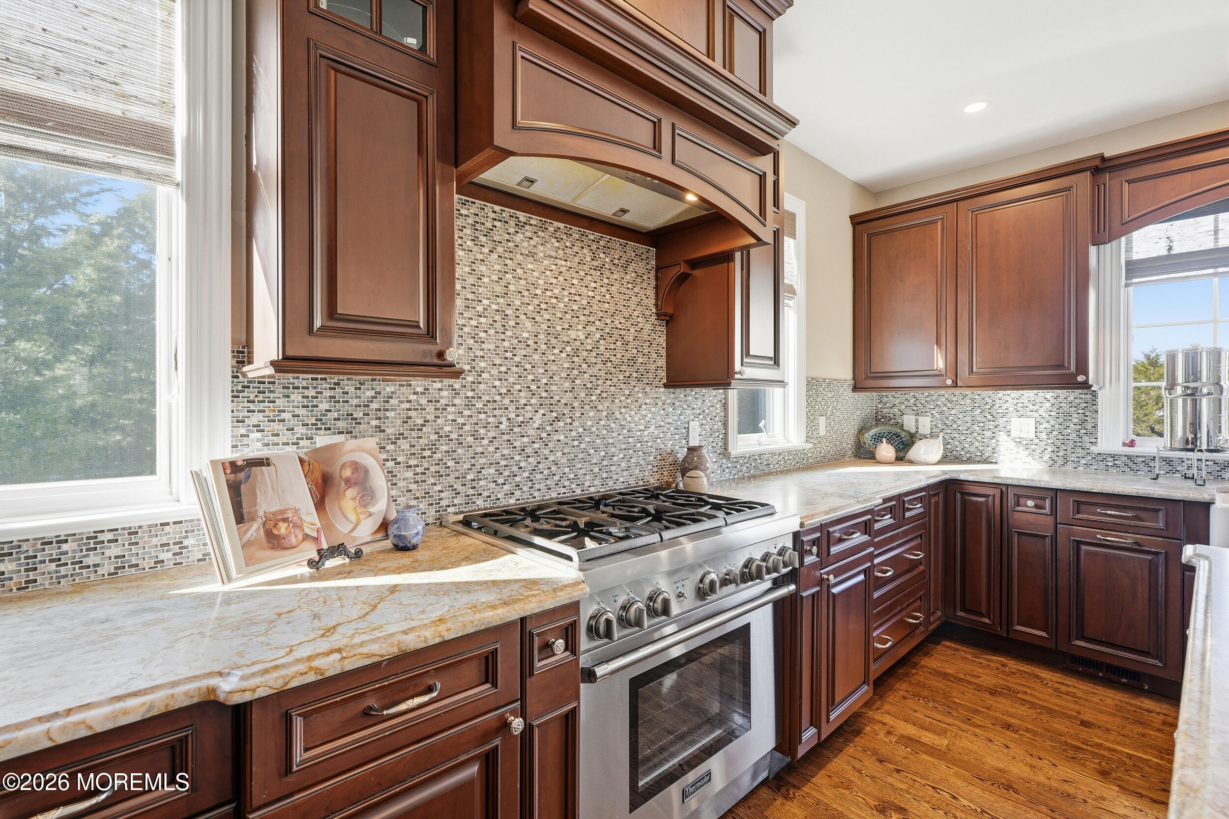 619 Bowne Road Asbury Park, NJ 07712 - Photo 17 of 69 a kitchen with granite countertop a sink stove and cabinets