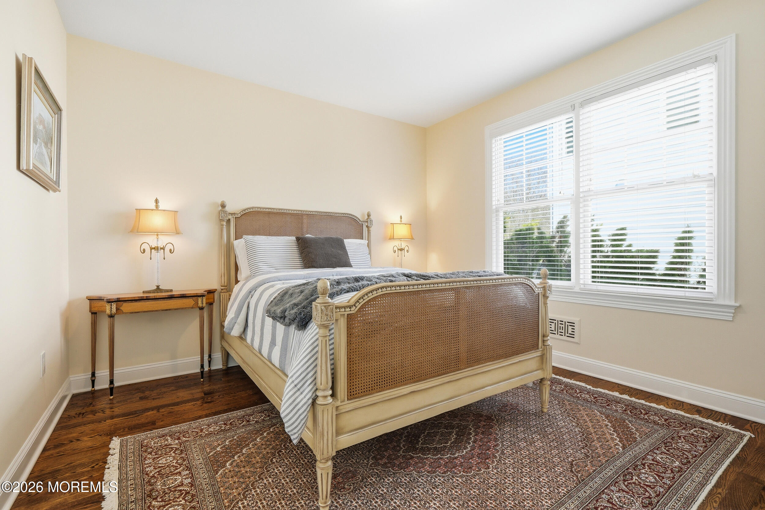 619 Bowne Road Asbury Park, NJ 07712 - Photo 27 of 69 a bed sitting in a bedroom next to a window