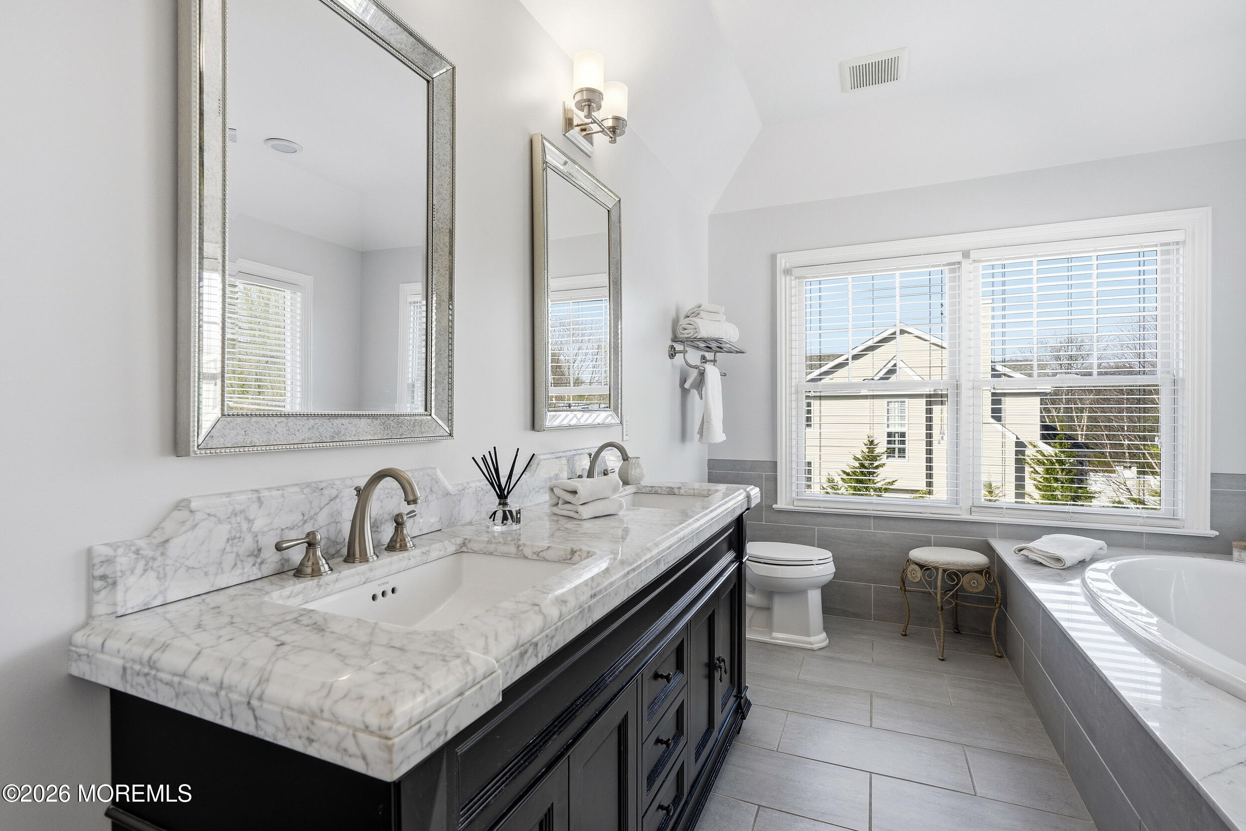 619 Bowne Road Asbury Park, NJ 07712 - Photo 37 of 69 a bathroom with a granite countertop sink and a bathtub