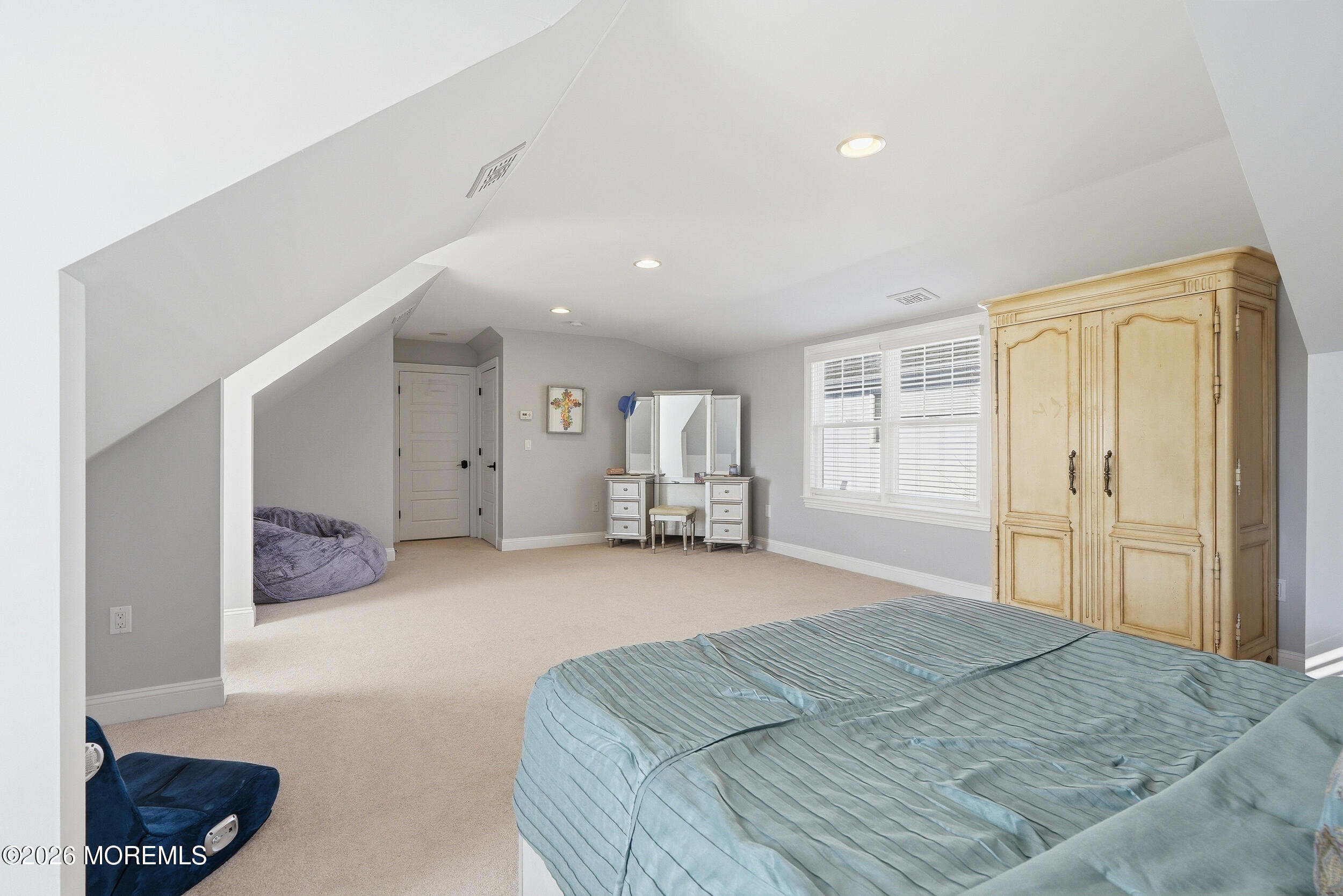 619 Bowne Road Asbury Park, NJ 07712 - Photo 42 of 69 a spacious bedroom with a bed and a window