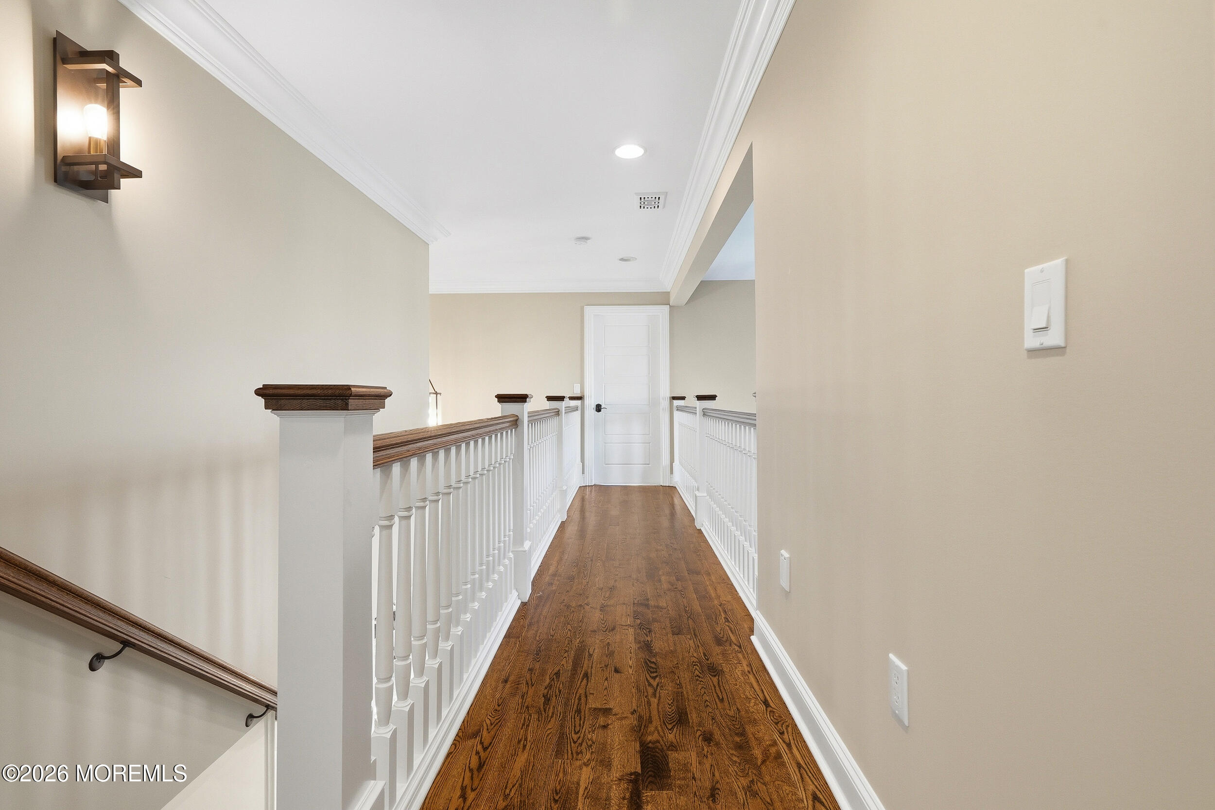 619 Bowne Road Asbury Park, NJ 07712 - Photo 46 of 69 a view of a hallway with wooden floor and staircase