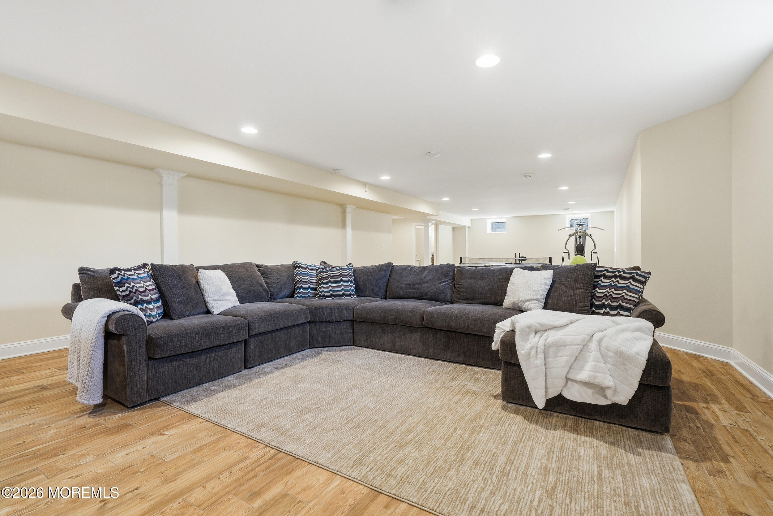 619 Bowne Road Asbury Park, NJ 07712 - Photo 56 of 69 a living room with furniture and a wooden floor