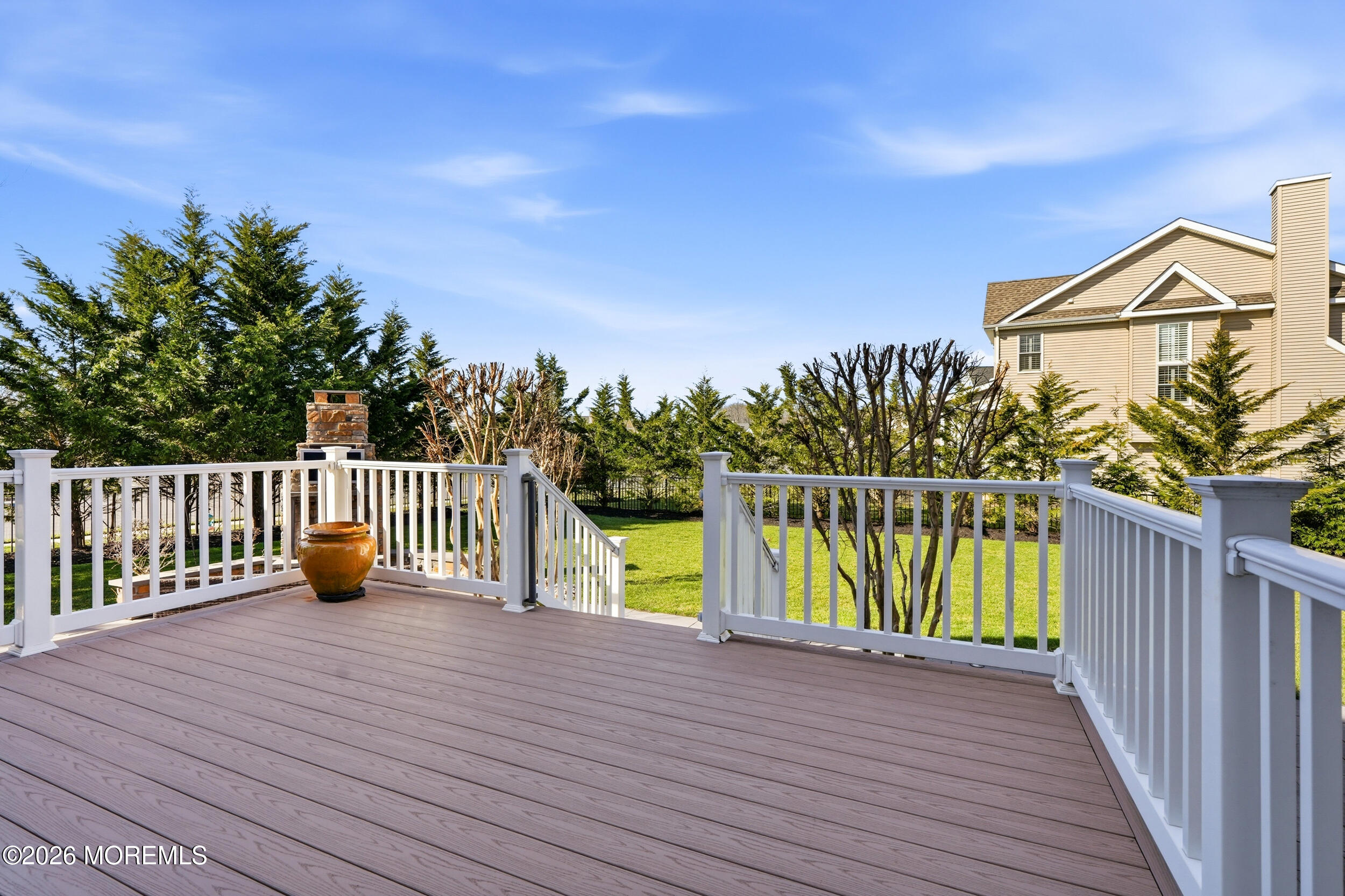 619 Bowne Road Asbury Park, NJ 07712 - Photo 59 of 69 a view of a deck with wooden floor and fence with a garden